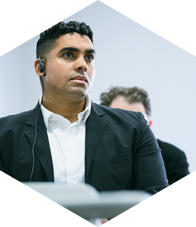 A participant from a G-NETS participating city listening to a presentation