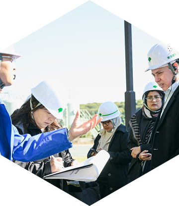 A Tokyo Bay-side Landfill staff member instructs participants