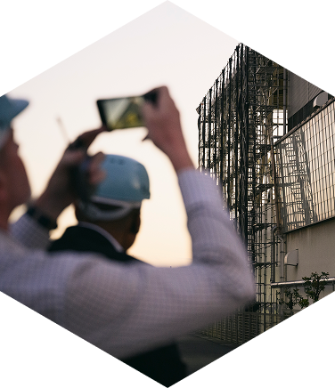 A participant taking photos of recycling facilities