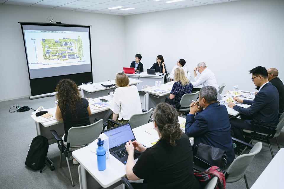 Participants receive a briefing on soft measures for disaster prevention, including leveraging social media.